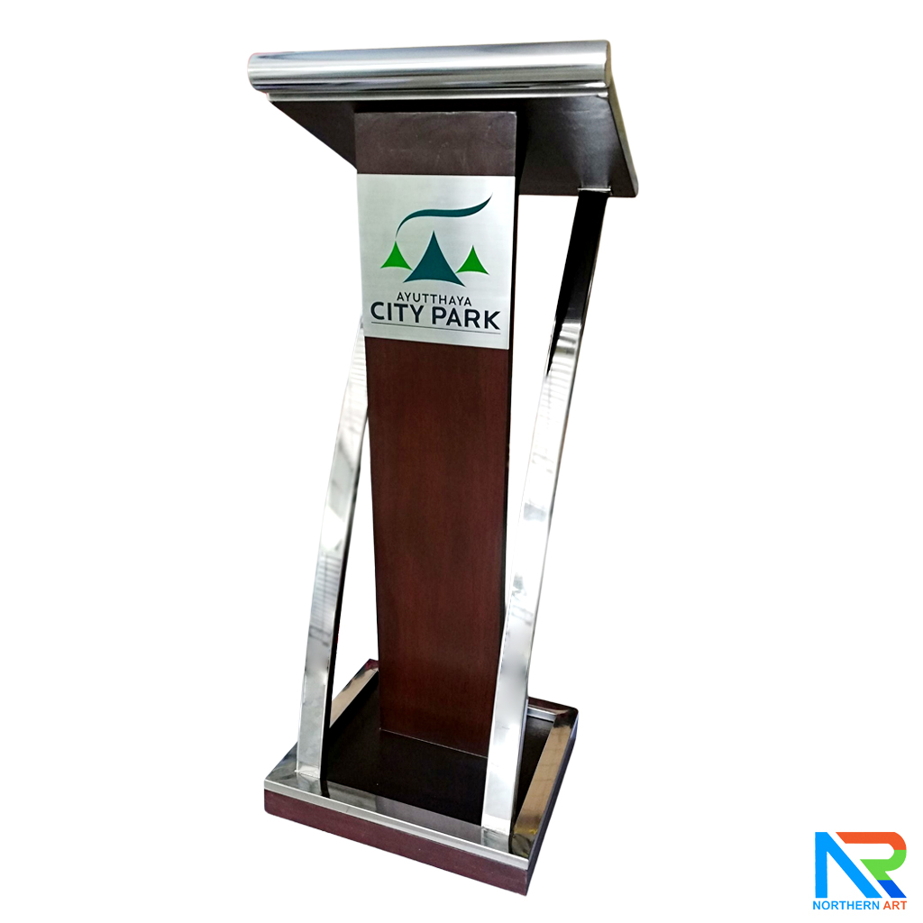 โพเดียมไม้จริง สีโอ๊คน้ำตาล PD-01 ขนาด (W) 48x (L) 51 (H) 120 cm Top หุ้มสแตนเลส เกรด 304 พร้อมตกแต่งเสาโค้งสแตนเลส