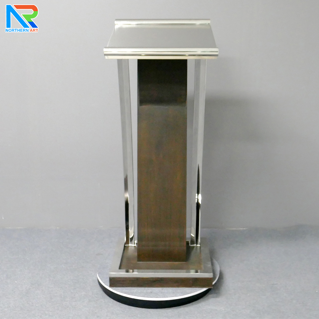 โพเดียมไม้จริง สีโอ๊คน้ำตาล PD-01 ขนาด (W) 48x (L) 51 (H) 120 cm Top หุ้มสแตนเลส เกรด 304 พร้อมตกแต่งเสาโค้งสแตนเลส