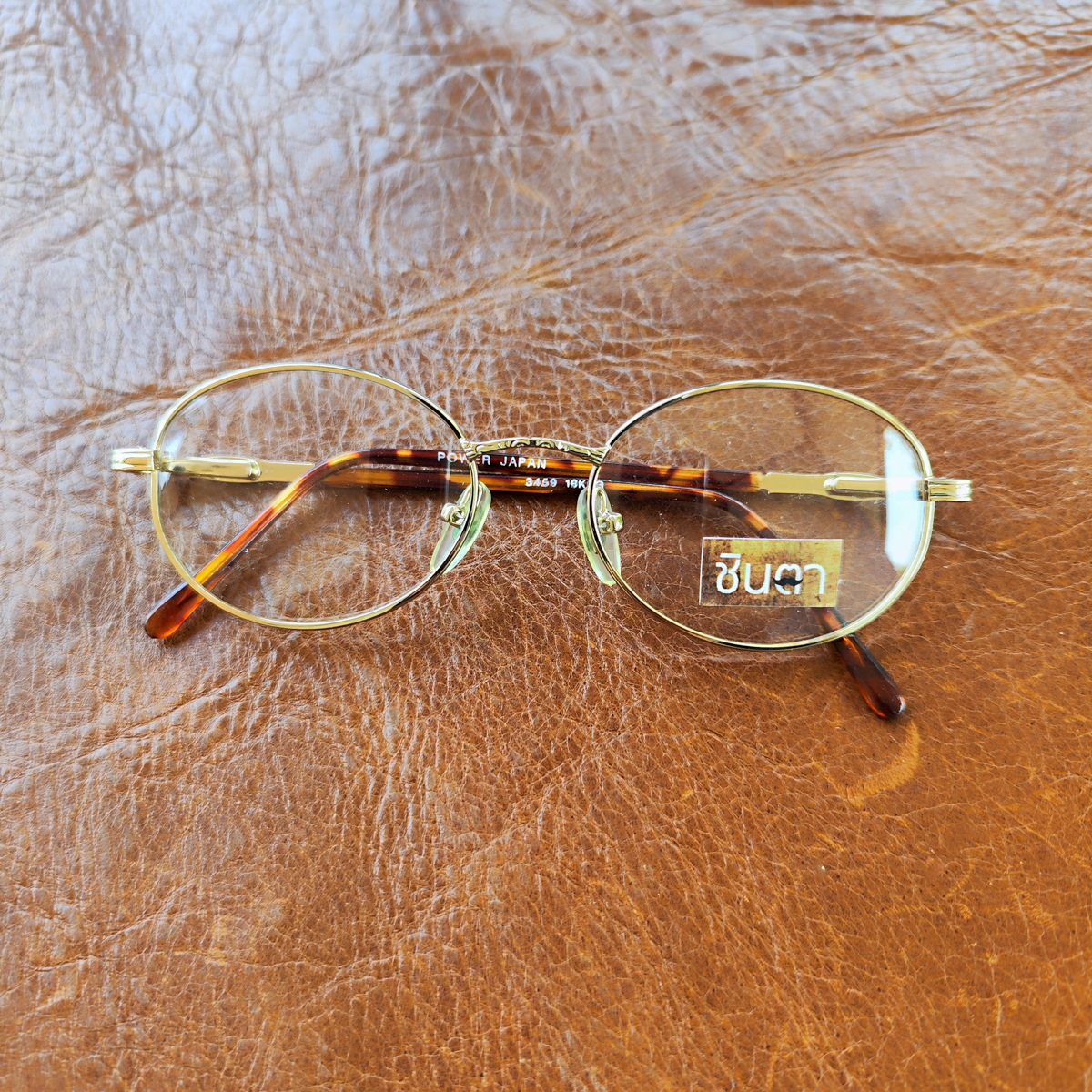 กรอบแว่นตา แว่นตาวินเทจ แว่นเก่าเก็บยุค 90s รุ่น Gold Power กรอบสีทอง สวยงาม ทรงรีมน รองรับการนำไปตัดเลนส์สายตา วินเทจแท้ หายากและไม่มีผลิตอีกแล้ว นำเสนอโดย ร้านชินตา